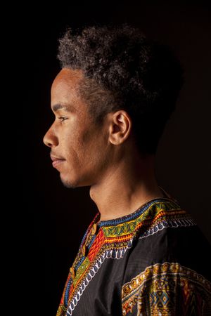 man smiling and looking away