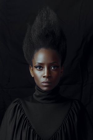 Portrait of Black woman wearing turtleneck shirt