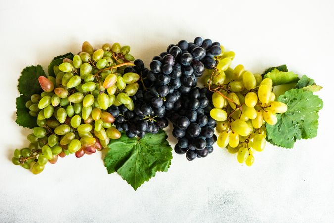 Top view of fresh red & green grapes on counter