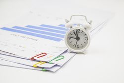 Alarm clock, and papers with clips