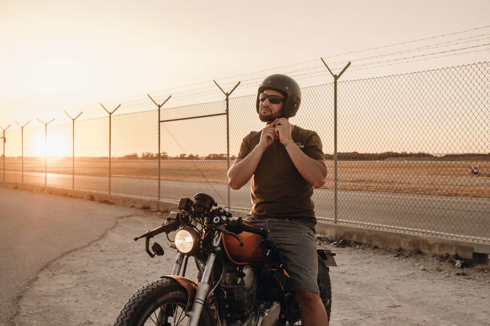 Strong man driving motorcycle