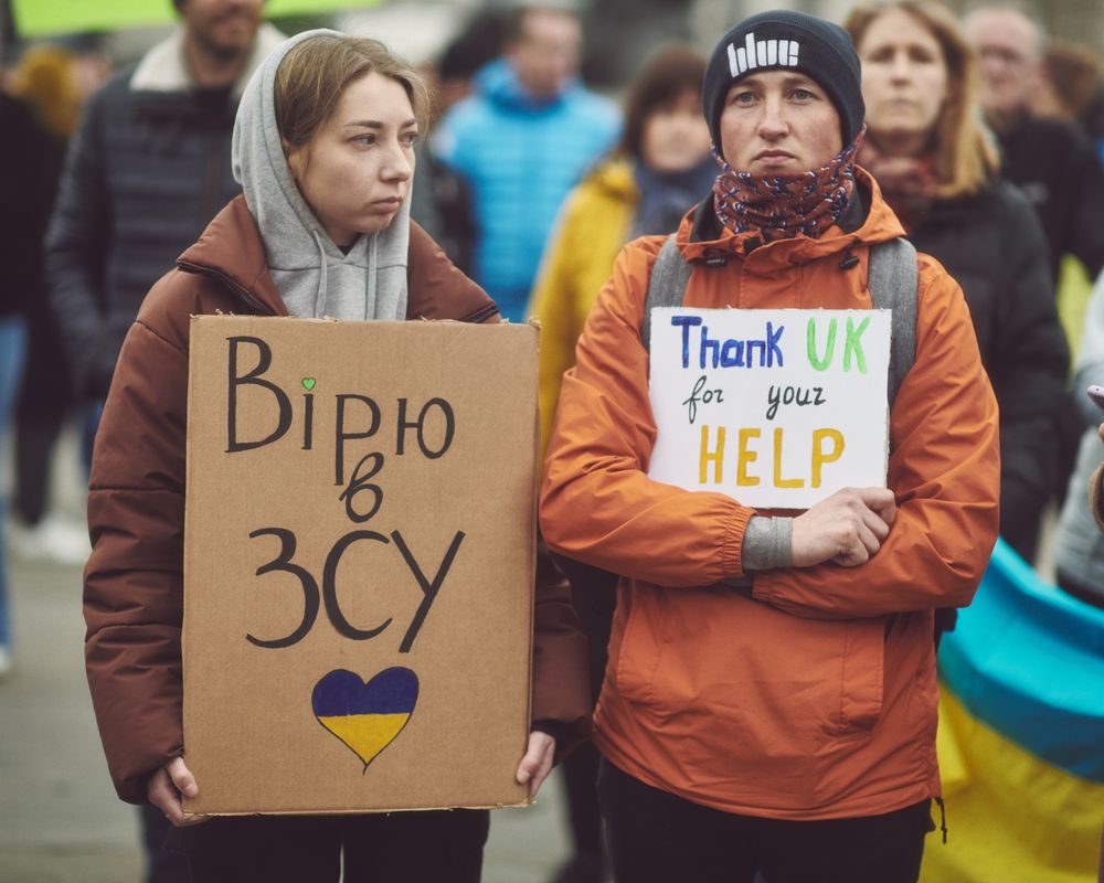 London, England, United Kingdom - March 5 2022: Man and women with signs in support of Ukraine