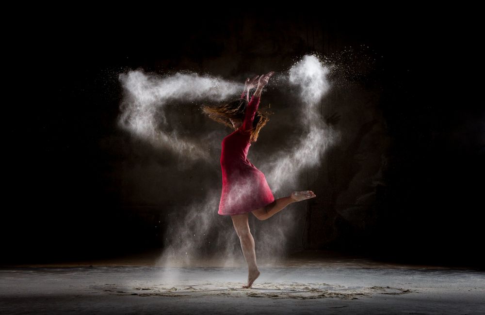 Young woman between fog in darkness