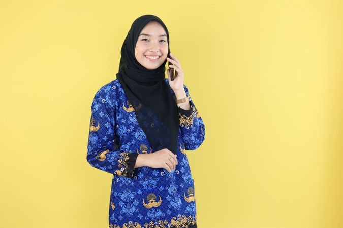 Joyful Female Indonesian Government Worker Wearing Baju Korpri