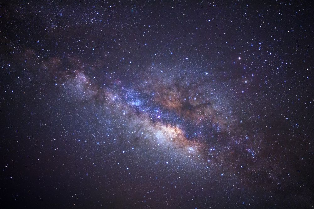 milky way galaxy with cloud and space dust in the universe, Long exposure photograph, with grain.