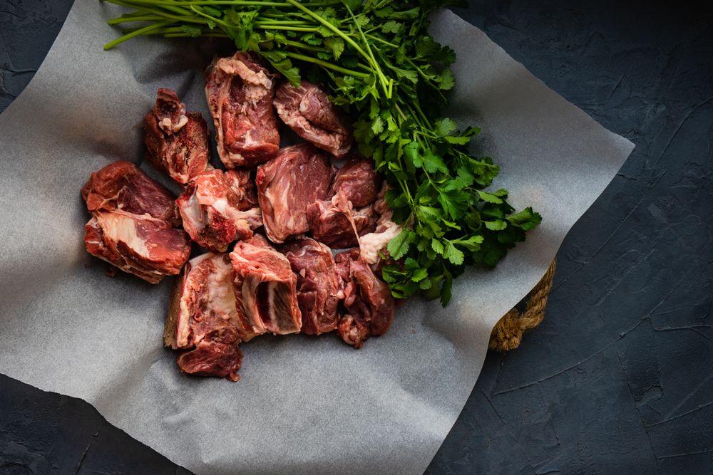 Raw meat and cilantro ready to cook