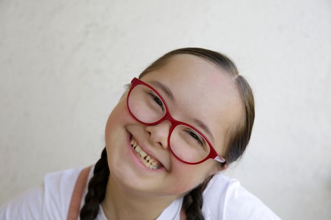 Close up of young girl smiling at camera