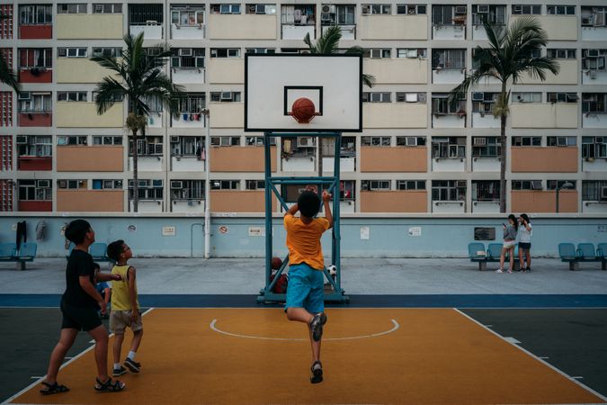 Boys playing basketball in Hong Kong