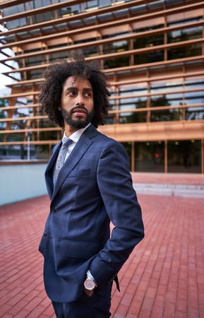 Confident businessman looking over shoulder