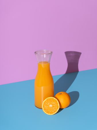 Orange juice bottle isolated on a vibrant background