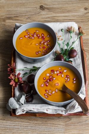Served bowls of delicious pumpkin soup