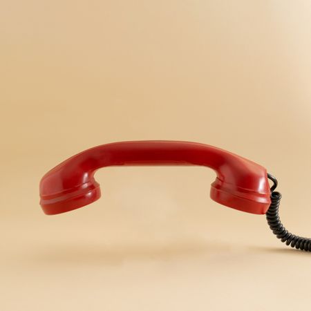 Ear piece of red vintage phone