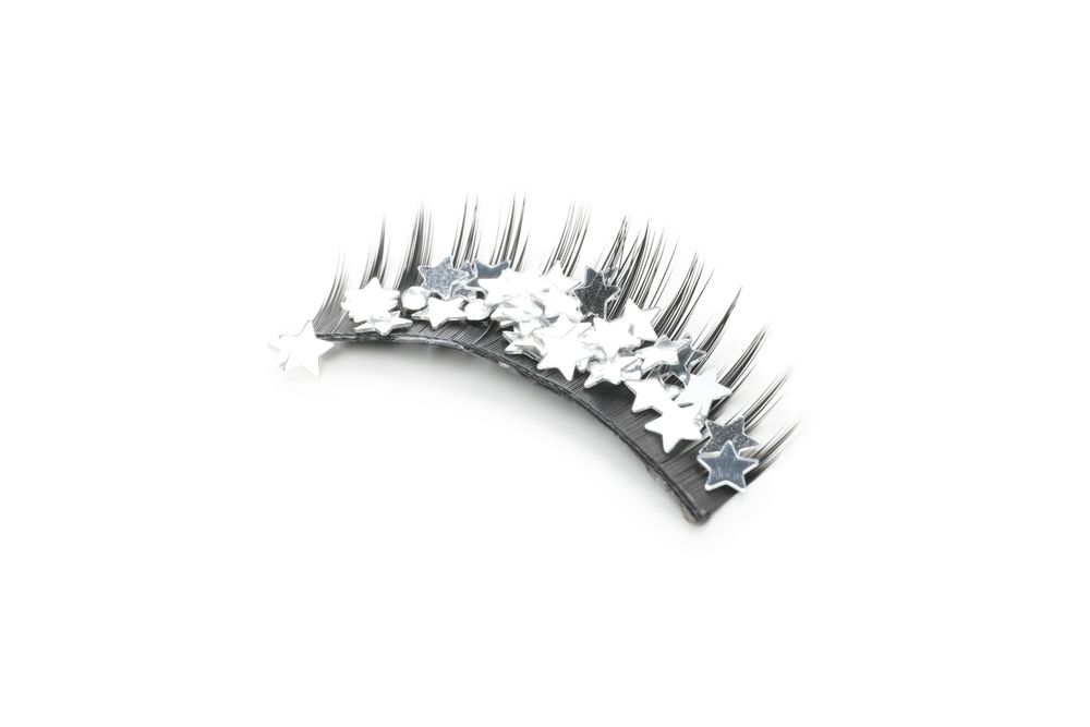 Concept of cosmetology tools, false eyelashes, isolated on light background