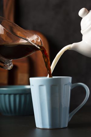Cup of coffee with creamy milk.