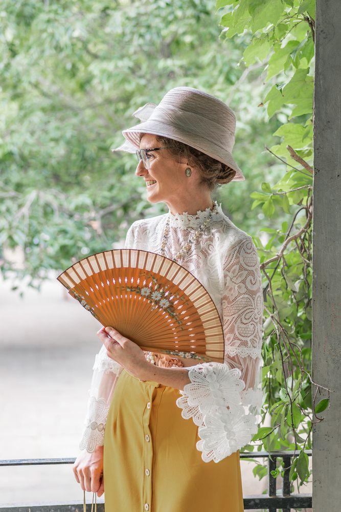 Woman with retro fan in park