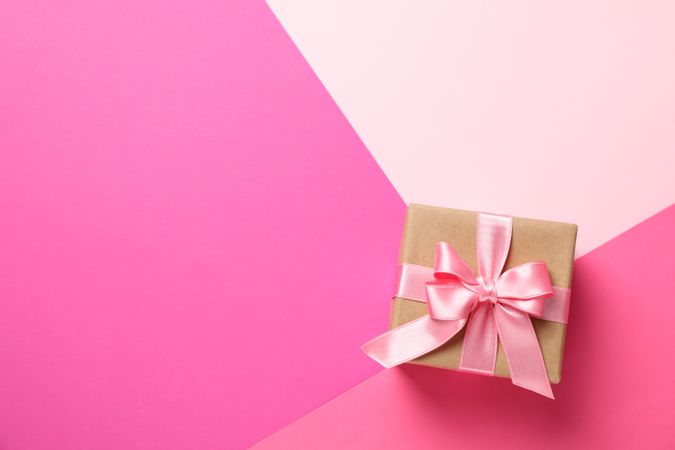 Gift box on multicolor background, top view