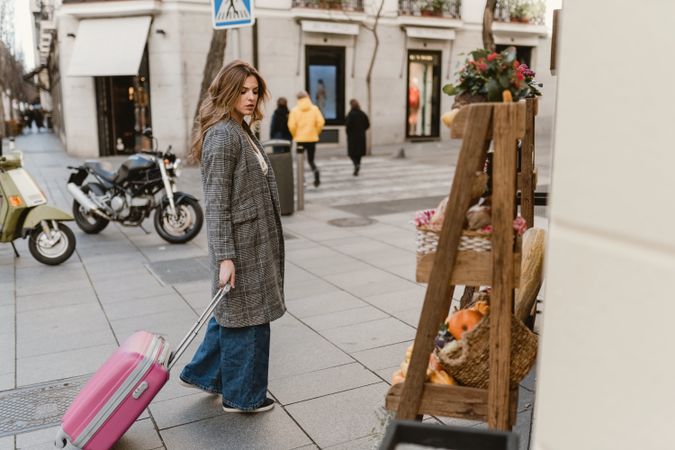 Female tourist near grocery shop