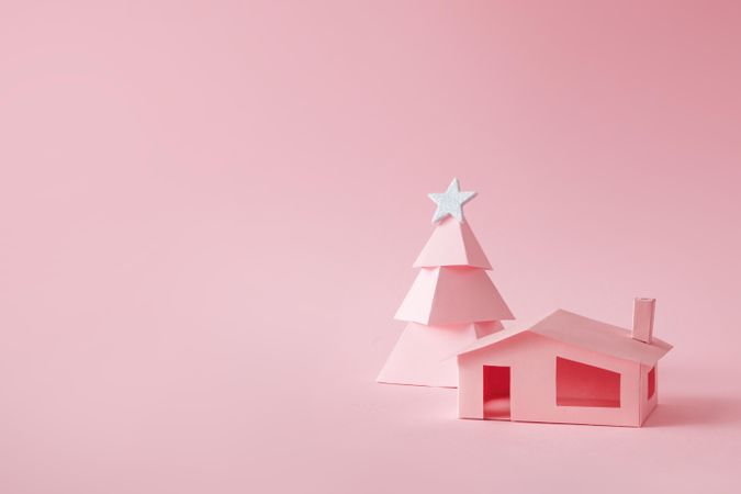 Pink Christmas tree, with house on pink background