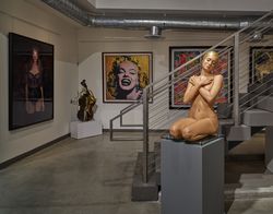 Realistic sculpture of nude swimmer at Miami Art Gallery