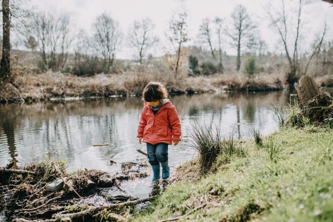 Young girl walking around a marsh