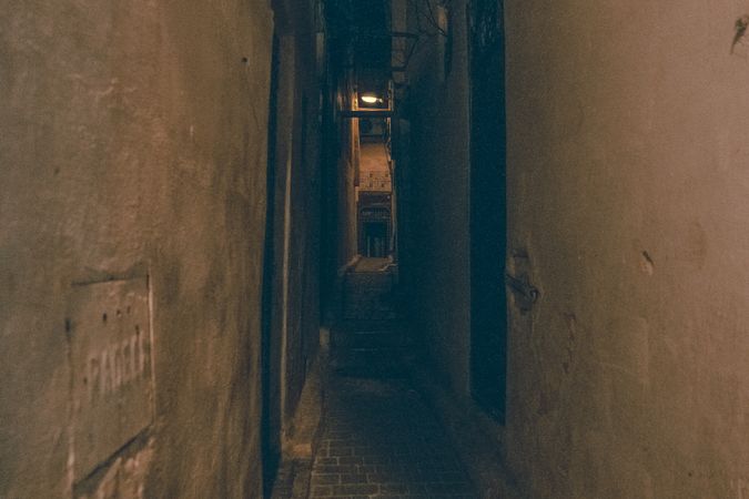 Old narrow street of town at night
