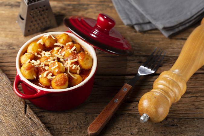 Gnocchi with tomato sauce and grated Parmesan cheese.