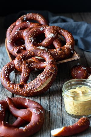 Delicious baked pretzels on wooden table