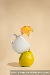 A stacked pear, mug and autumn leaf 41xdl5