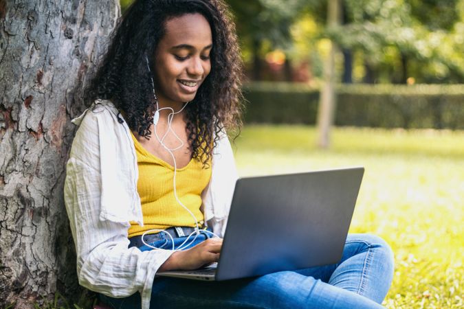 College student working with laptop on campus