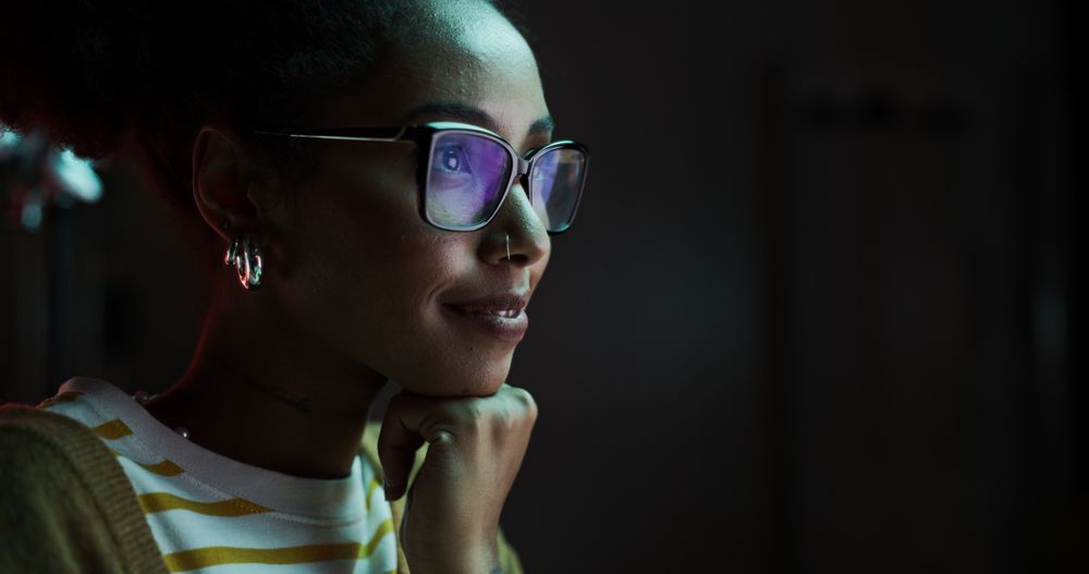 Portrait of a Happy Successful Black Businesswoman Using Desktop Computer in Creative Agency in the Evening.
