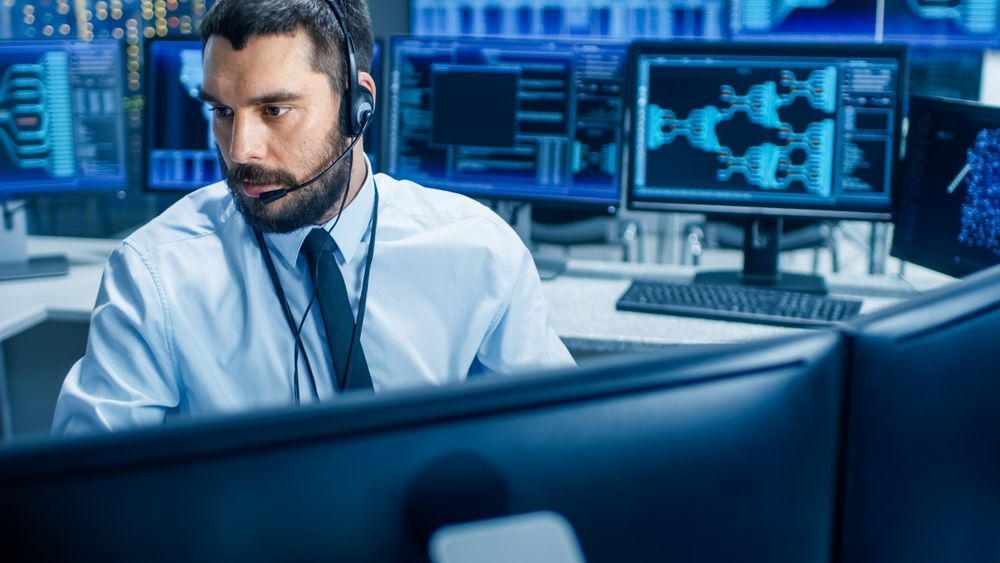 In the System Monitoring Room Dispatcher Wearing Headset Observers Proper Functioning of the Facility.