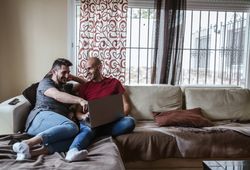 Gay couple with computer