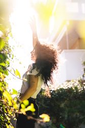 Cheerful woman in garden
