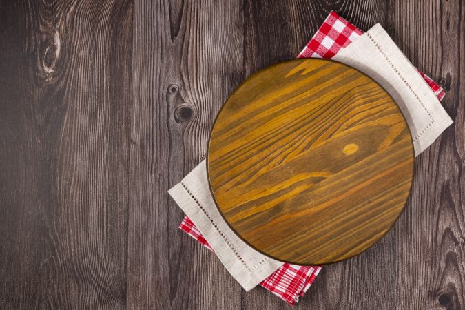 Empty pizza board on rustic wooden table. Top view image.