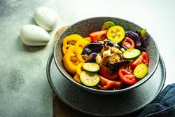 Healthy gourmet vegetarian salad in bowl on counter