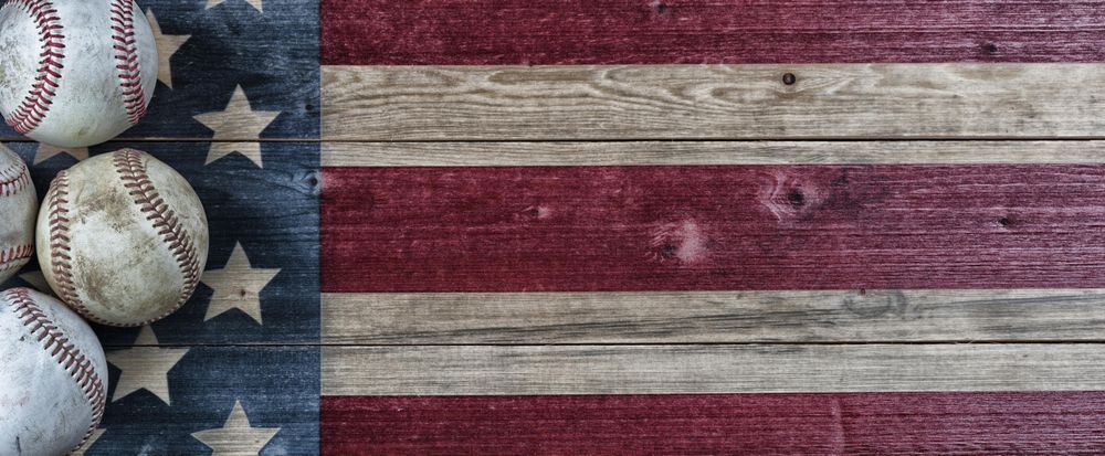 Baseballs on vintage USA wooden flag for sports concept