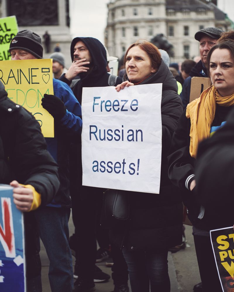 London, England, United Kingdom - March 5 2022: Woman with “Freeze Russian Assets” sign