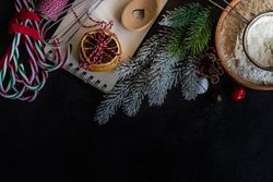 Top view of baking ingredients on dark counter