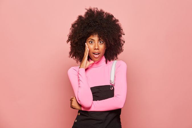 Shocked Black woman looking at camera