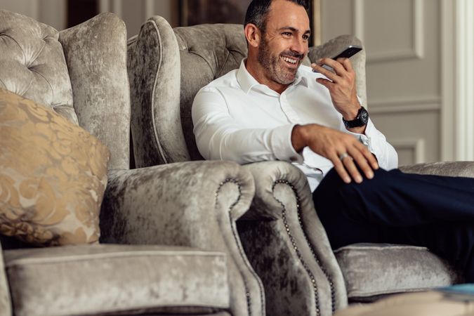 Happy businessman having a conversation over phone
