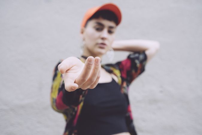 Woman in red cap suggesting to join