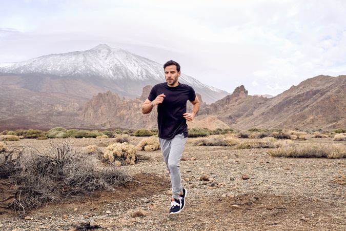man running near mountain