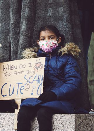 London, England, United Kingdom - June 6th, 2020: Girl holding sign at BLM protest in face mask