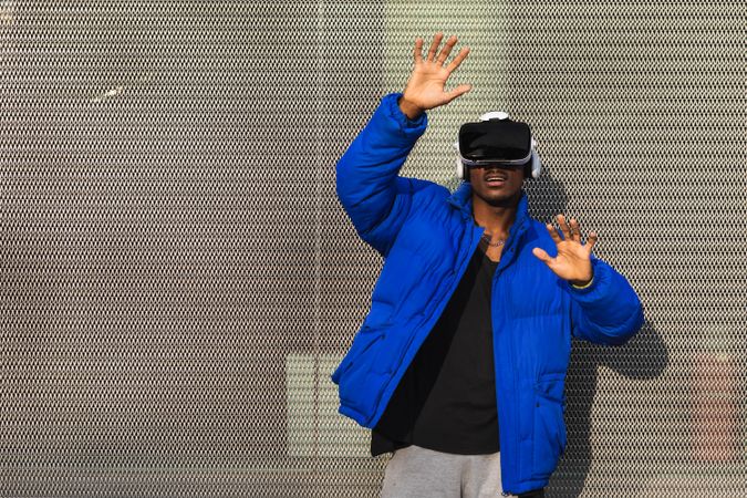 Black man experiencing virtual reality in city