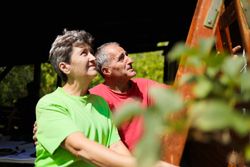 Older wife and her husband during the renovation of their home.