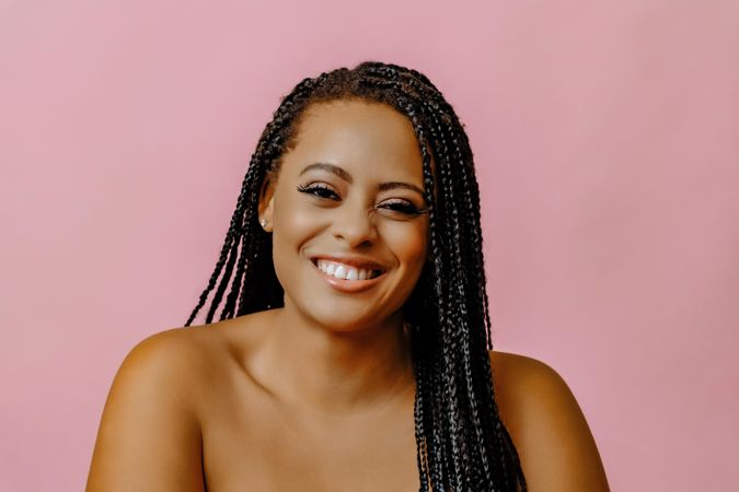 Female smiling in pink studio shoot