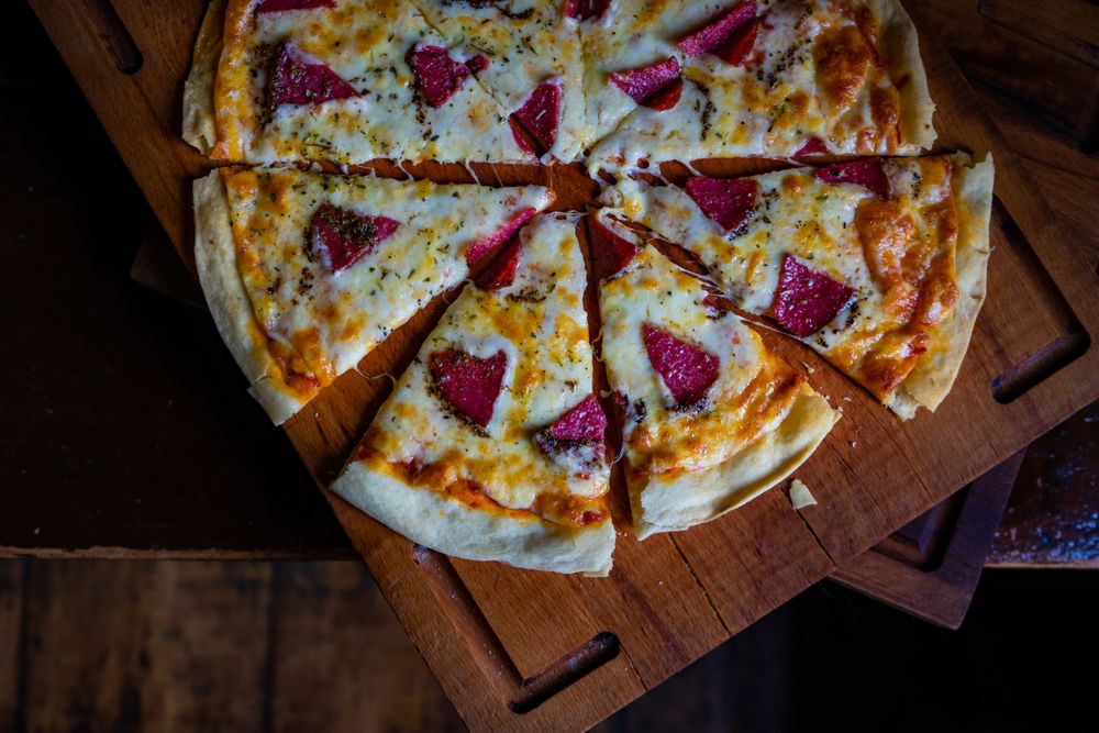 Top view of pizza with slices of meat