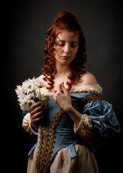 Baroque woman with closed eyes holding flowers