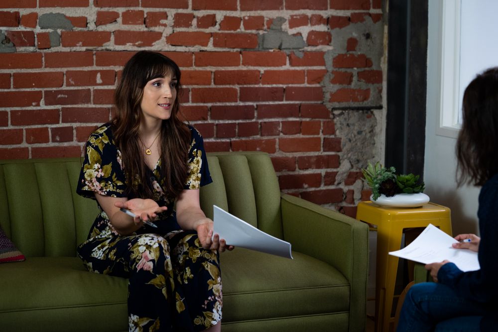 Transgender woman and colleague reviewing notes