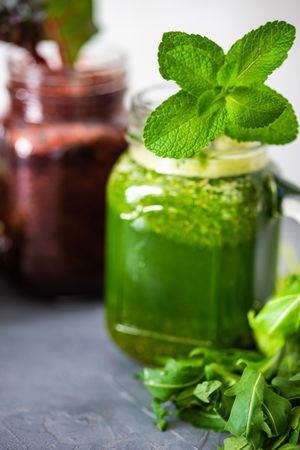 Close up of green smoothie with mint leaves